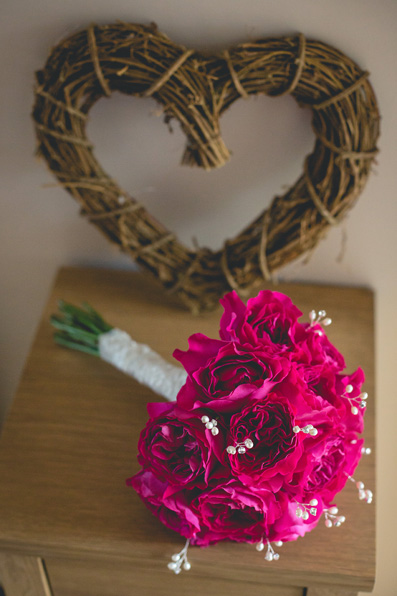 Striking fuschia bride's bouquet | Autumn wedding at Wolfscastle hotel by Whole Picture Weddings